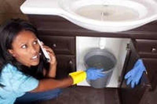 woman with plumbing leak